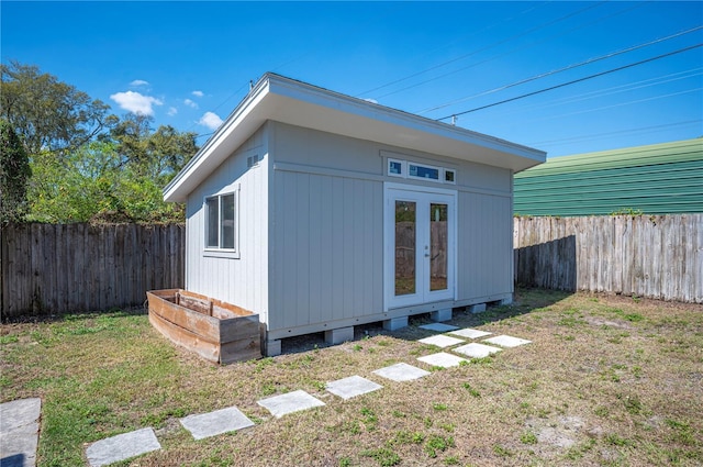 exterior space featuring an outbuilding and a fenced backyard