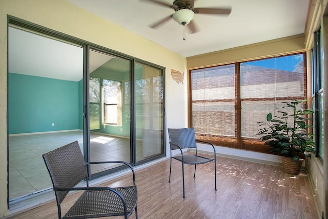 sunroom with a ceiling fan