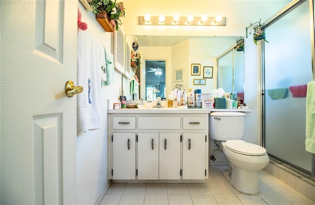 full bath with toilet, a ceiling fan, a shower stall, vanity, and tile patterned flooring