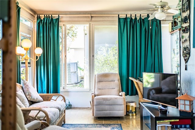 sitting room featuring a ceiling fan and tile patterned floors