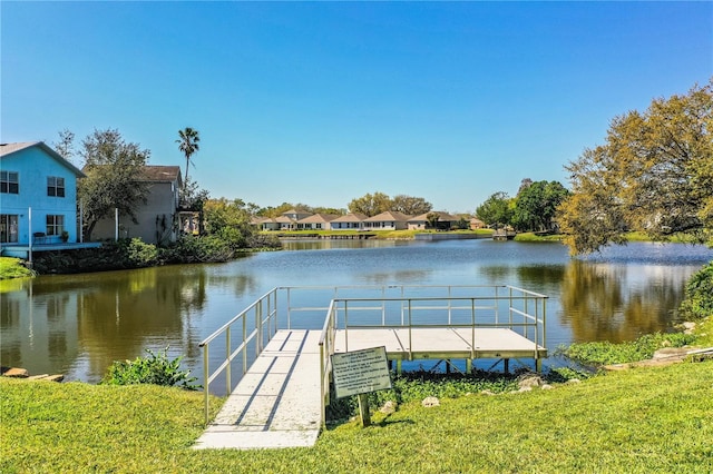 dock area with a water view and a residential view