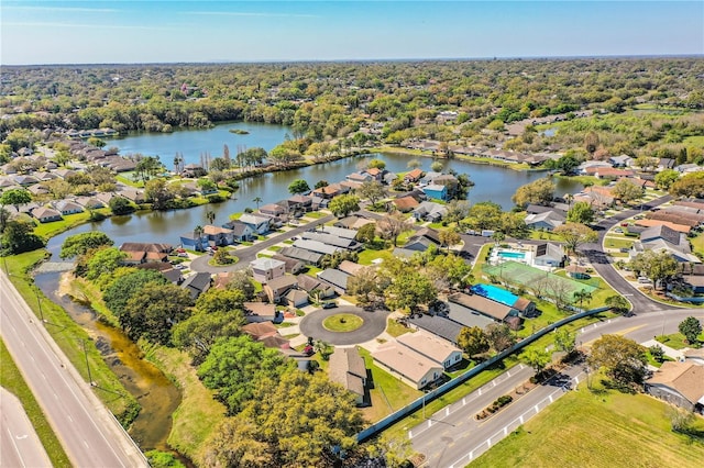 drone / aerial view featuring a water view and a residential view