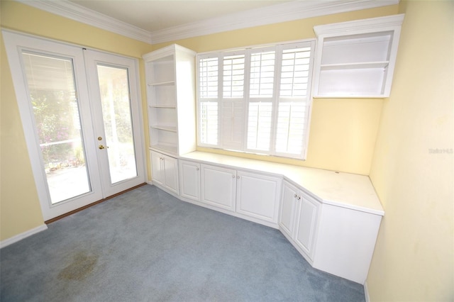 empty room with french doors, light carpet, and crown molding