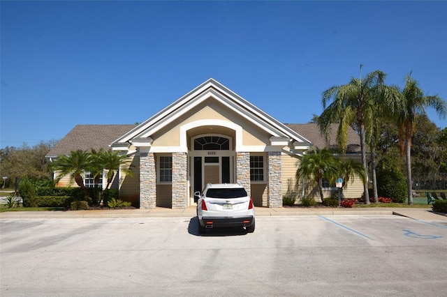 view of property featuring uncovered parking