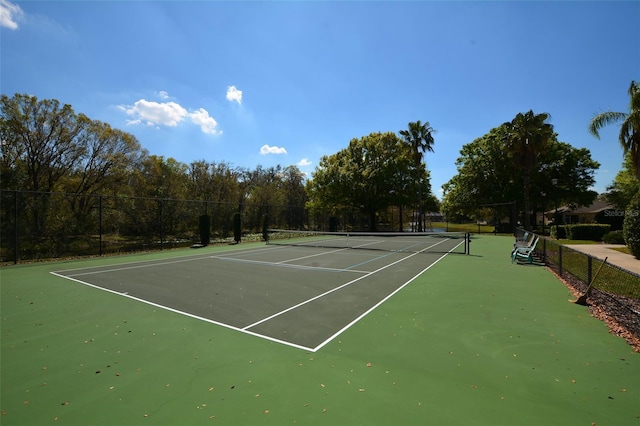 view of tennis court with fence