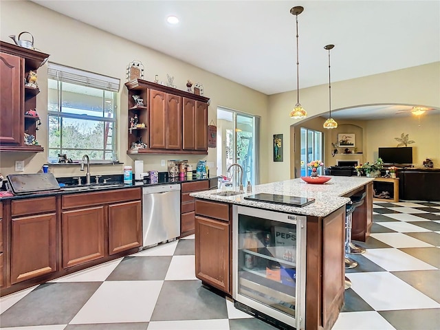 11175 Hyde St, Weeki Wachee, FL 34614 - kitchen with open shelves, wine cooler, light flooring, dishwasher, and a sink