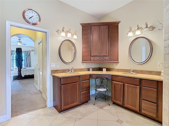 11175 Hyde St, Weeki Wachee, FL 34614 - ensuite bathroom featuring tile patterned flooring, double vanity, and a ceiling fan