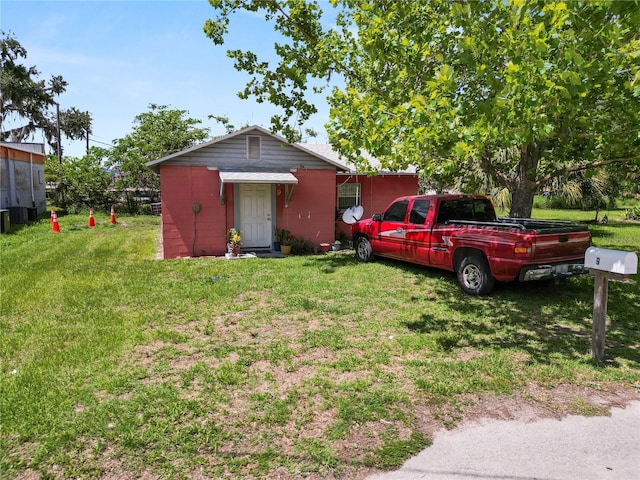 ranch-style home with a front yard