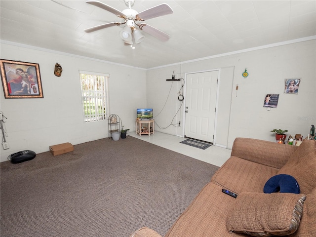 carpeted living area featuring a ceiling fan and crown molding