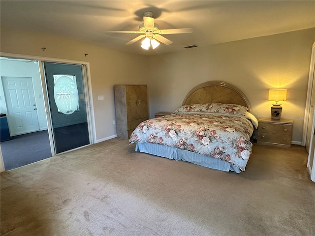 bedroom with carpet, visible vents, and a ceiling fan