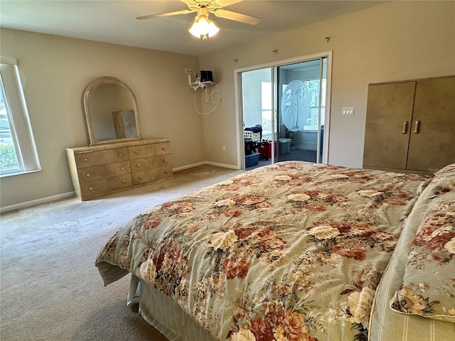 bedroom with a ceiling fan, baseboards, and carpet flooring