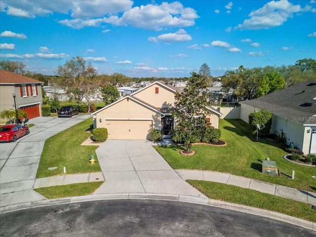 view of front facade with a garage, driveway, a residential view, stucco siding, and a front lawn