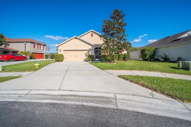 view of front of home with an attached garage, stucco siding, concrete driveway, and a front yard