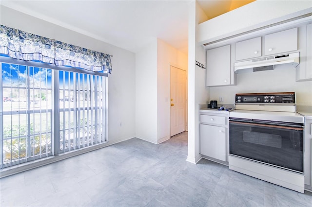 kitchen featuring under cabinet range hood, white cabinetry, baseboards, light countertops, and white range with electric stovetop