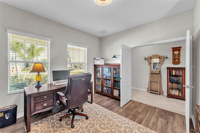 office with baseboards and wood finished floors