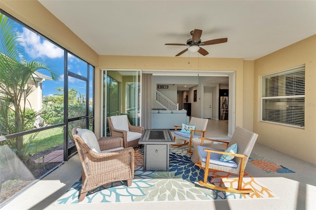 sunroom with ceiling fan