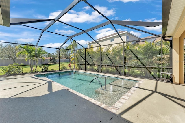 outdoor pool with a lanai and a patio