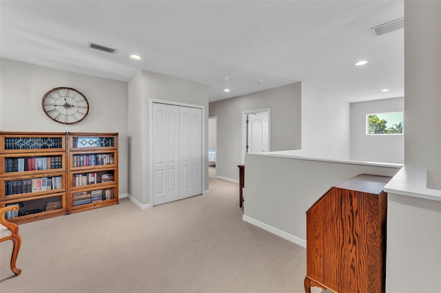 living area featuring recessed lighting, an upstairs landing, visible vents, baseboards, and carpet