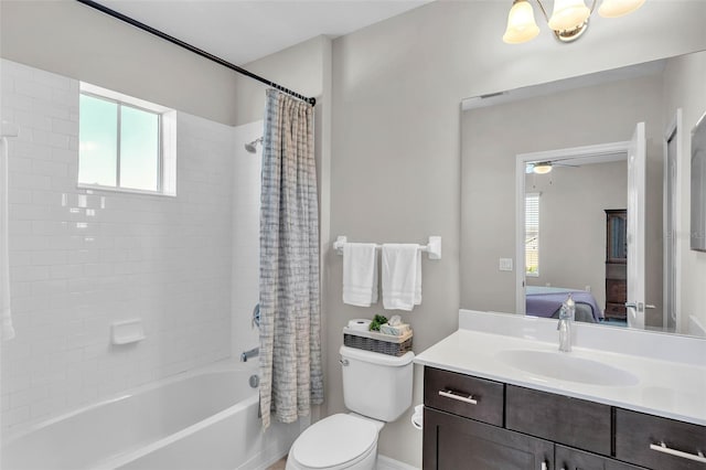 ensuite bathroom featuring shower / bath combo with shower curtain, a healthy amount of sunlight, vanity, and ensuite bathroom