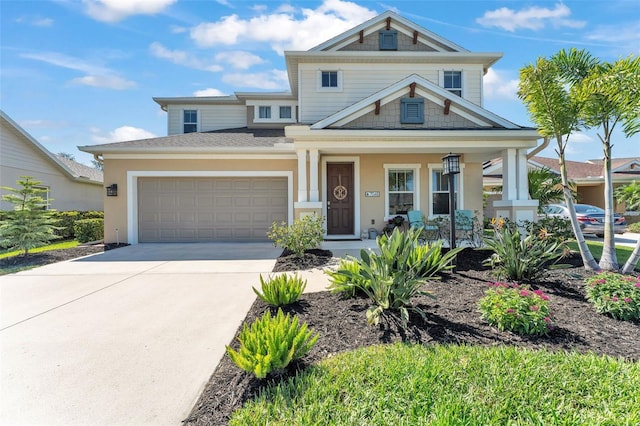 view of front facade featuring a garage, covered porch, driveway, and stucco siding