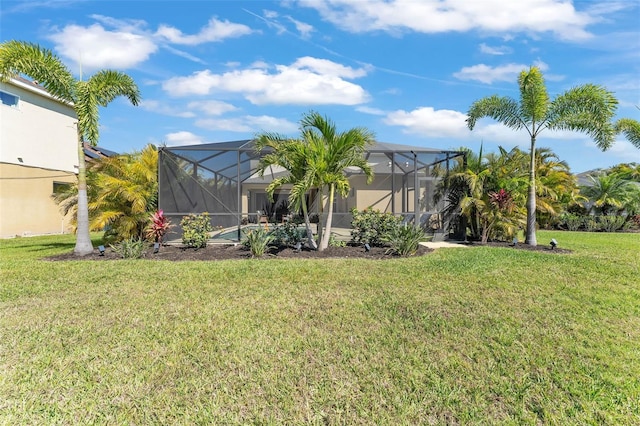 view of yard featuring glass enclosure