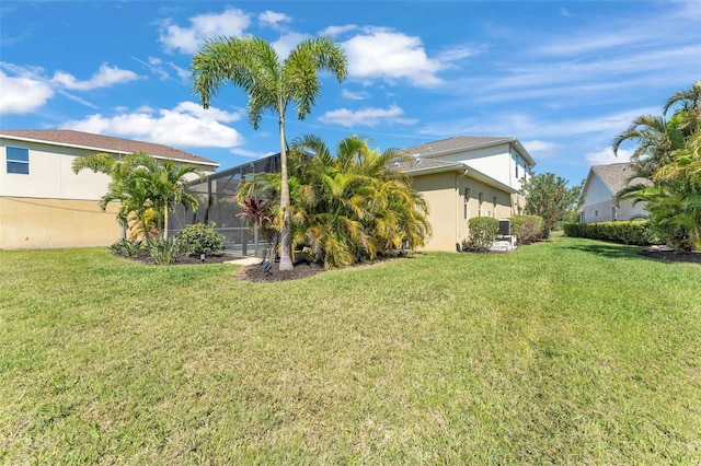 view of yard with a lanai