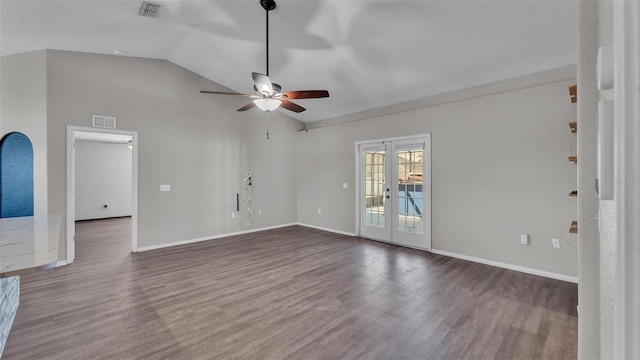 unfurnished living room featuring lofted ceiling, french doors, dark wood-type flooring, and visible vents