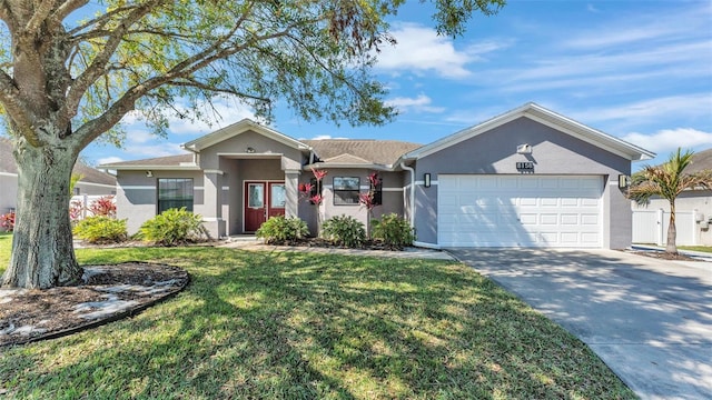 single story home with driveway, a front lawn, an attached garage, and stucco siding