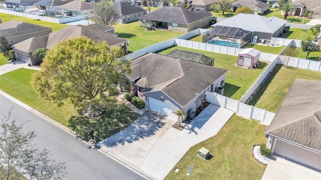 birds eye view of property with a residential view