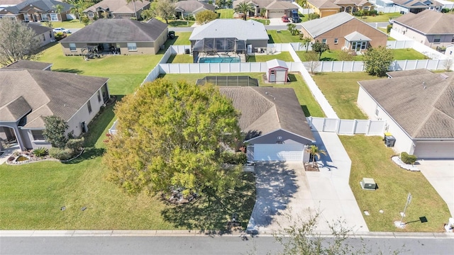 birds eye view of property with a residential view