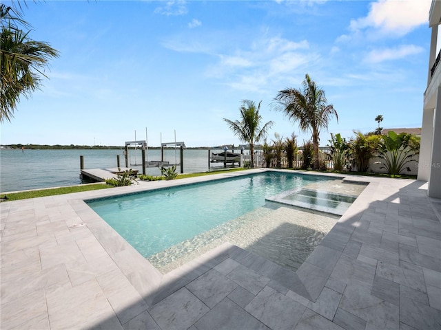 view of pool with a dock, a water view, a patio, and boat lift