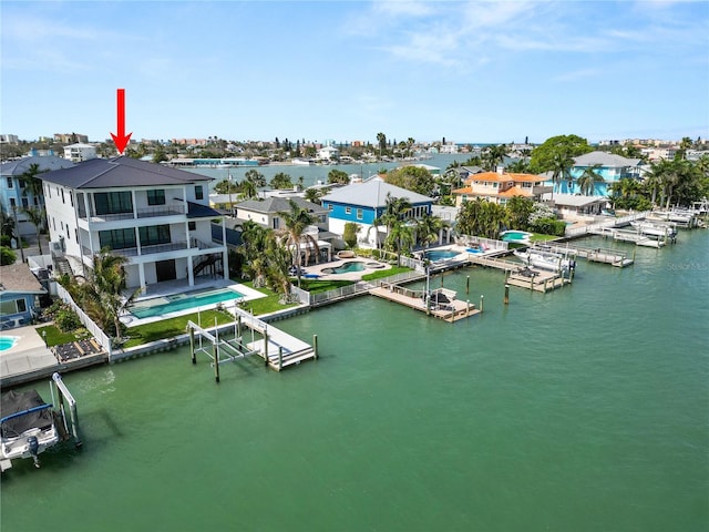 aerial view with a water view and a residential view