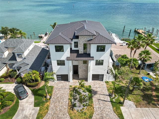 birds eye view of property with a water view
