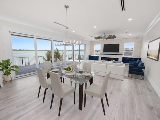 dining room featuring light wood-type flooring, a fireplace, baseboards, and recessed lighting