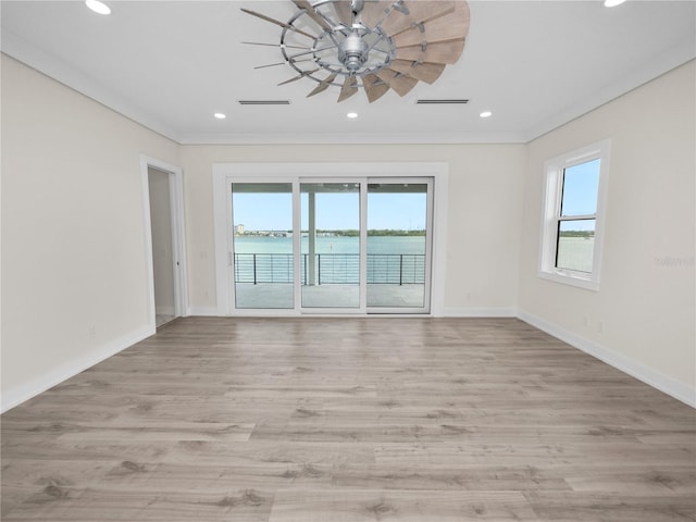 unfurnished room featuring baseboards, wood finished floors, visible vents, and recessed lighting