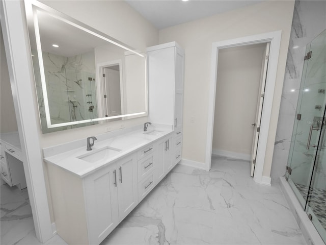 bathroom featuring a sink, baseboards, marble finish floor, a marble finish shower, and double vanity