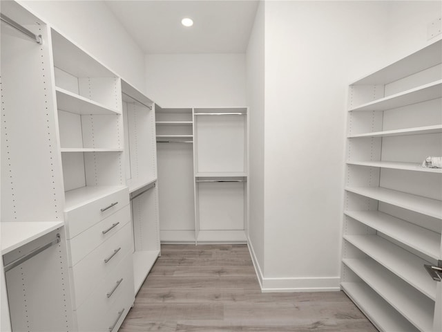 walk in closet featuring light wood-style flooring