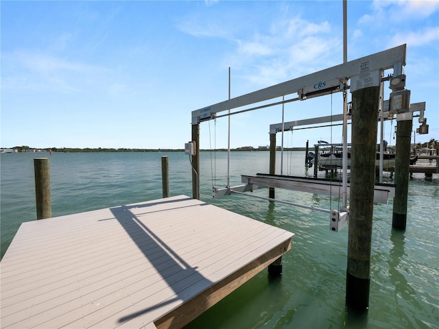 view of dock featuring a water view and boat lift