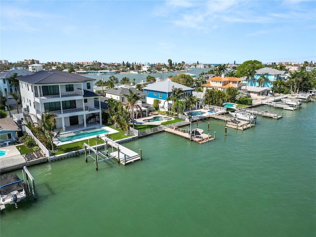 bird's eye view featuring a residential view and a water view