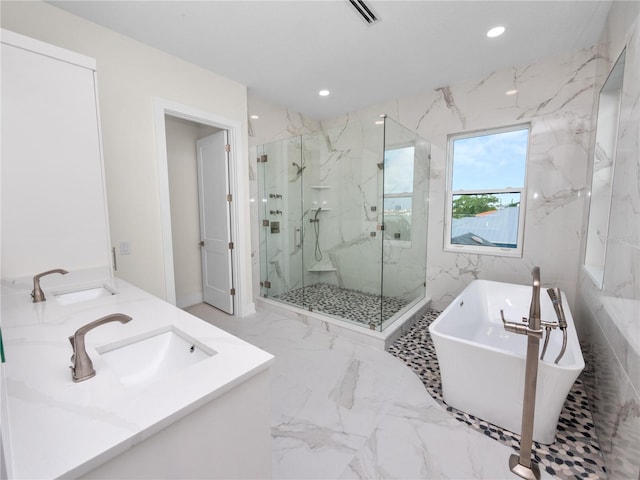 bathroom with marble finish floor, a marble finish shower, visible vents, and a sink
