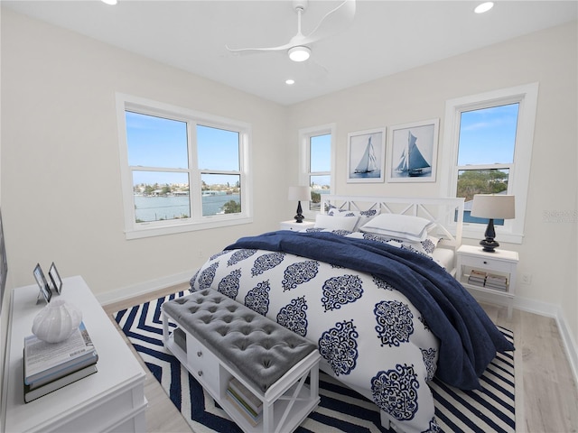 bedroom featuring light wood-type flooring, ceiling fan, baseboards, and recessed lighting