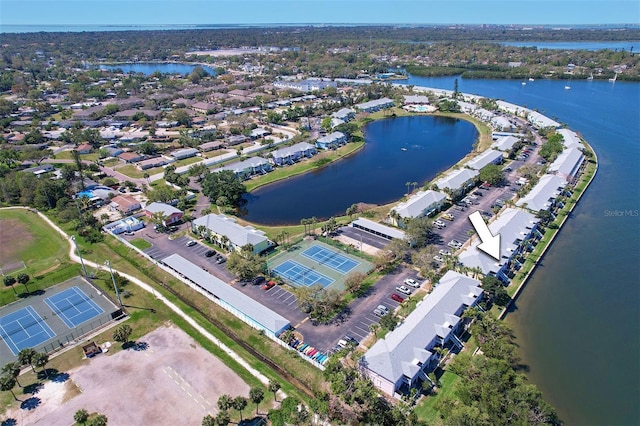 birds eye view of property featuring a residential view and a water view