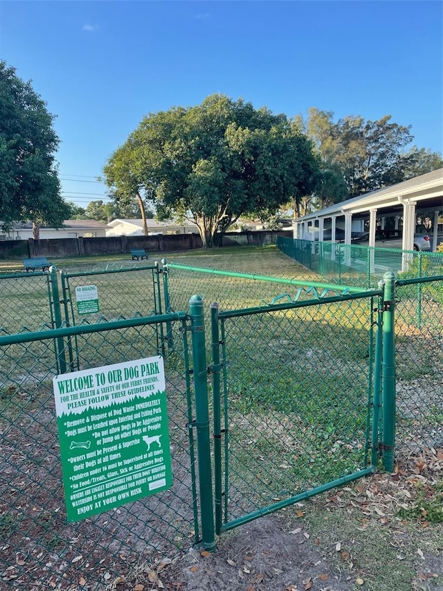 view of gate with fence