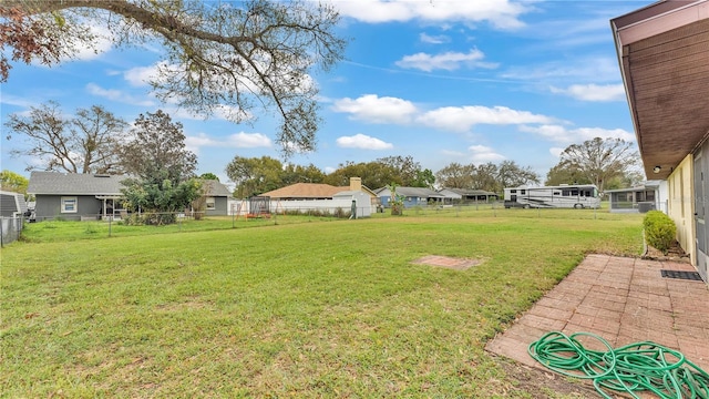 view of yard with a residential view and a fenced backyard