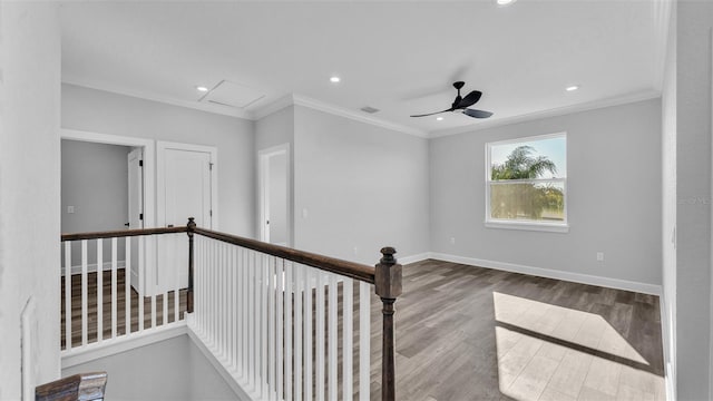 interior space featuring crown molding, recessed lighting, wood finished floors, and baseboards