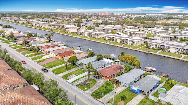 bird's eye view with a residential view and a water view