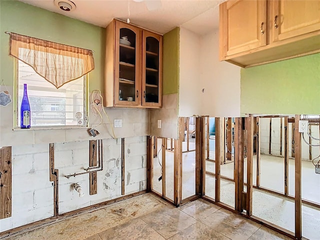 kitchen featuring glass insert cabinets