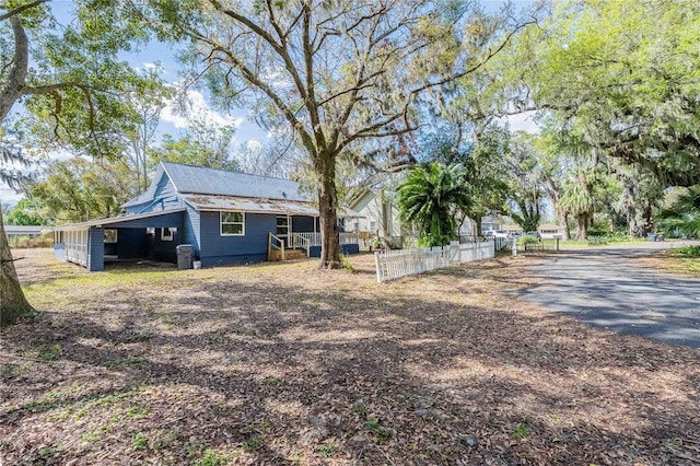 rear view of house with fence