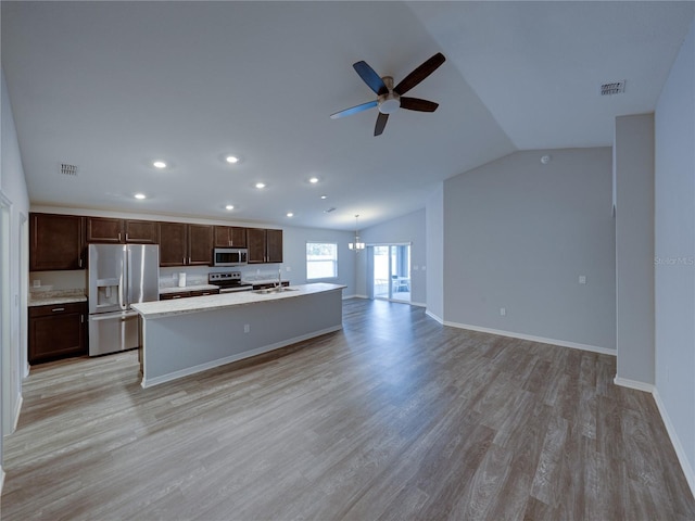 kitchen with visible vents, stainless steel appliances, light countertops, and a sink