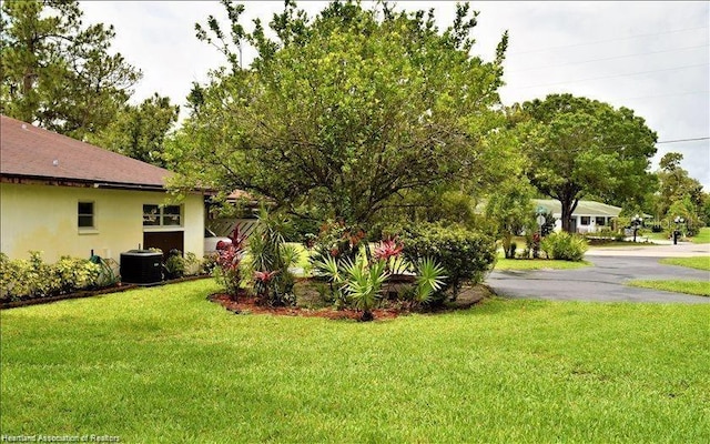 view of yard featuring central AC